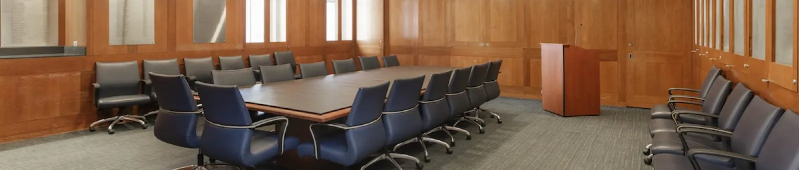 conference room with 16 chairs around a table