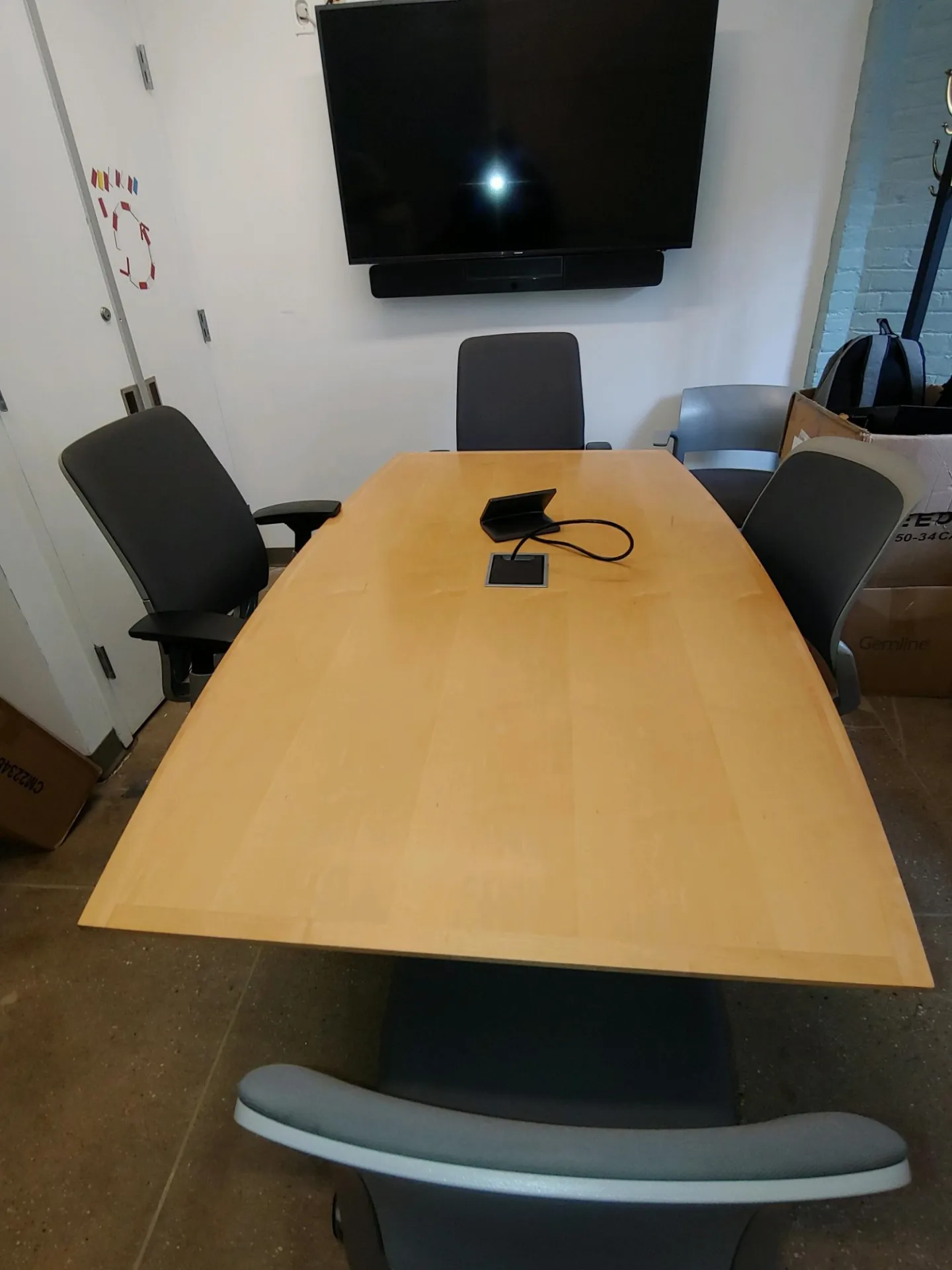 Room 203A, medium conference table and A/V connections, seats 3-5