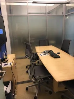 Large conference room with rectangle table with chairs